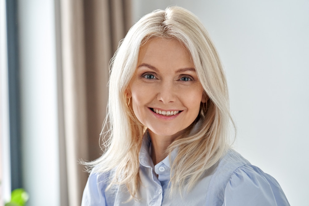 Smiling,Sophisticated,50s,Middle,Aged,Blond,Business,Woman,Looking,At 1766171930 shutterstock 1921610171 2 1